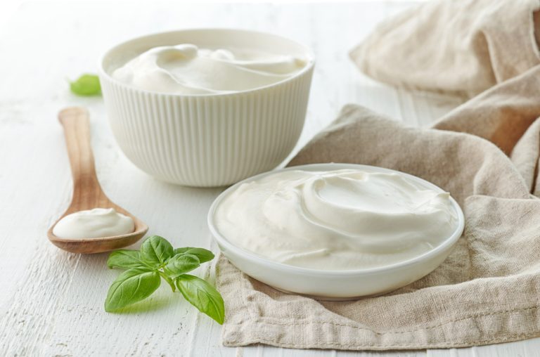bowls of sour cream or yogurt