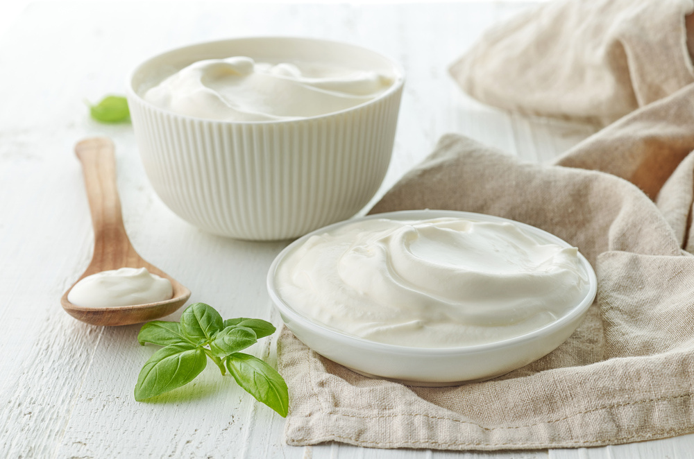 bowls of sour cream or yogurt