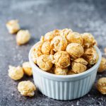 Caramel,Sweet,Popcorn,In,A,White,Bowl.,Toning.,Selective,Focus